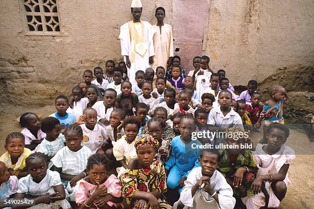 The Marabout of Mopti and his pupils in the Koran school. -