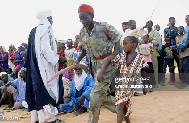 Niger, Bagazi: Hauka ceremony - The spirit Anie who represents the rainbow takes a child whom he will take with him unless a chicken is offered. The...