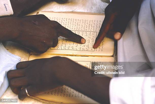 Marabout teaching the Koran in a Dogon village. -