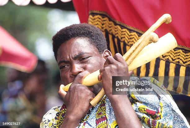 Ghana: Blowing the royal ivory horn. -