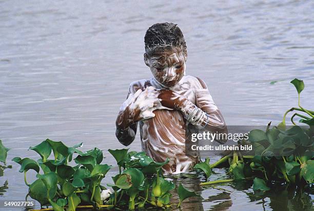 Girl bathing in Lake Nokoue. -