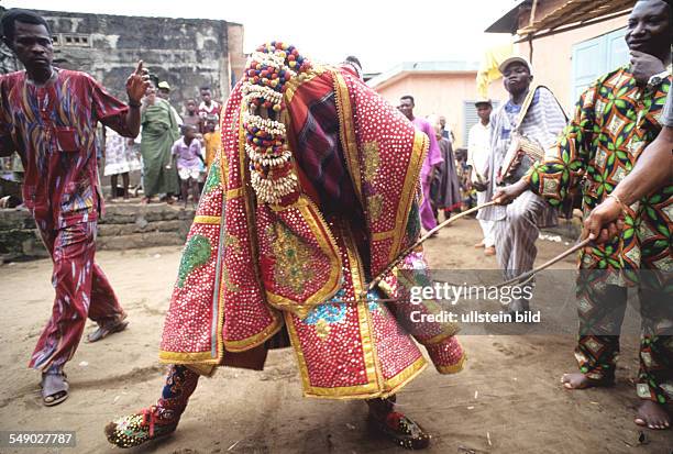Bale Robe Senate Assistants called bale hold back the egungun robes with thin canes ...