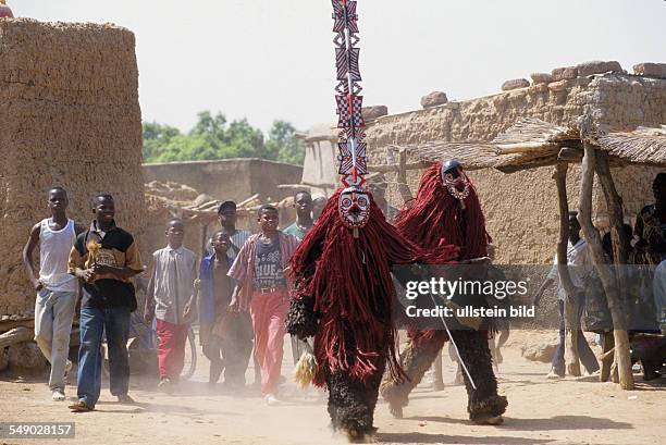 Burkina Faso: The long mask called MITCHI. Mitchi represents the mosque. -