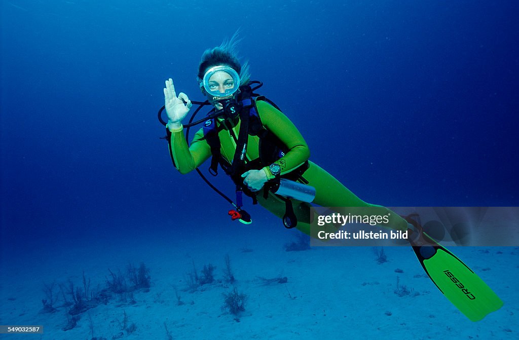 Scuba diver shows o.K. signal, Bahamas, Caribbean Sea, Grand Bahama Island