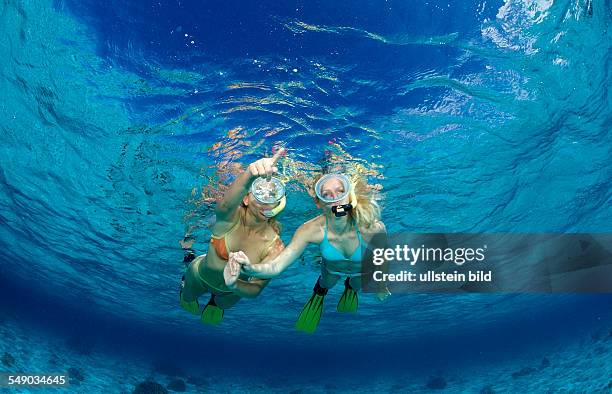 Two snorkeling girls, Komodo National Park, Indian Ocean, Indonesia