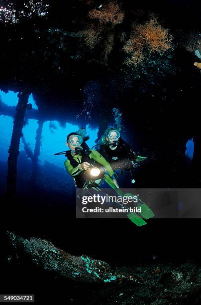 Two Scuba diver examine ship wreck Liberty, Bali, Tulamben, Indian Ocean, Indonesia