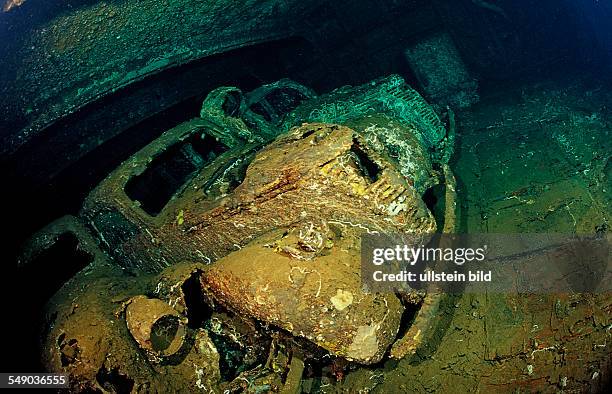 Scuba diver diving in the Umbria shipwreck, Military cars, Sudan, Africa, Red Sea, Wingate Reef