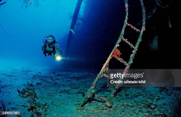 Scuba diver on the Hilma Hooker Ship Wreck, Netherlands Antilles, Bonaire, Caribbean Sea