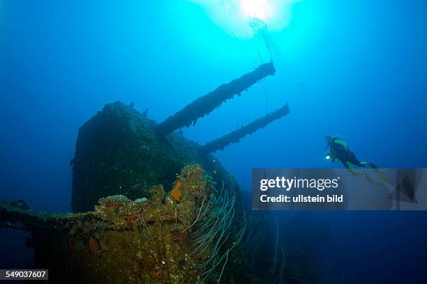 Diver and Twin 8-inch 55 caliber Gun on USS Saratoga, Marshall Islands, Bikini Atoll, Micronesia, Pacific Ocean