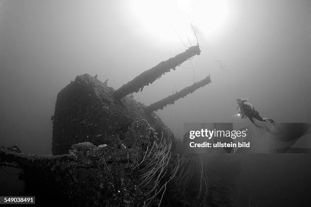 Diver and Twin 8-inch 55 caliber Gun on USS Saratoga, Marshall Islands, Bikini Atoll, Micronesia, Pacific Ocean