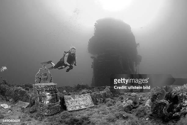 Diver finds Artifacts on Flight Deck of USS Saratoga, Marshall Islands, Bikini Atoll, Micronesia, Pacific Ocean