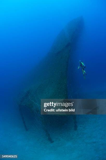 Diver at Bow of USS Arkansas Battleship, Marshall Islands, Bikini Atoll, Micronesia, Pacific Ocean