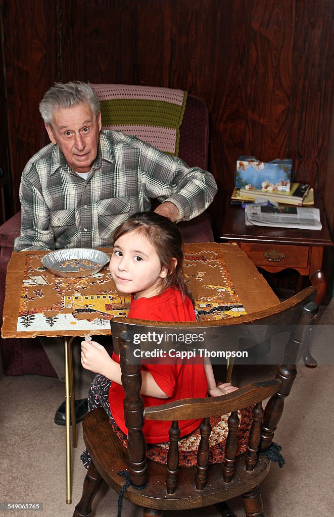 91 year old man playing with great granddaughter