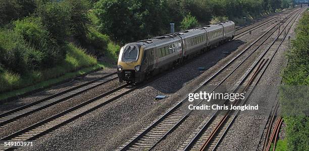 passenger train on quad rail line - high speed stock pictures, royalty-free photos & images