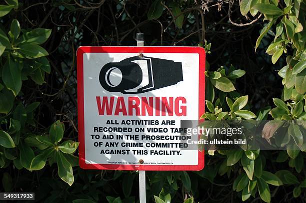 Caution sign against paparazzi in Malibu. Warning o video surveillance to protect the privacy of the stars