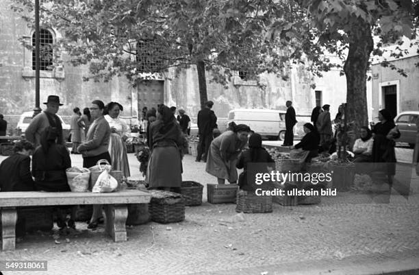 Spain, about 1960: Street scene. Women at the market place