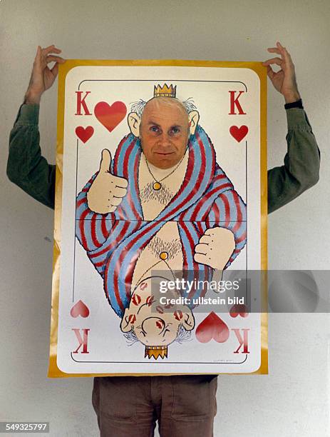 German cartoonist and actor Vicco von Bülow, Loriot, posing with one of his designed playing-cards