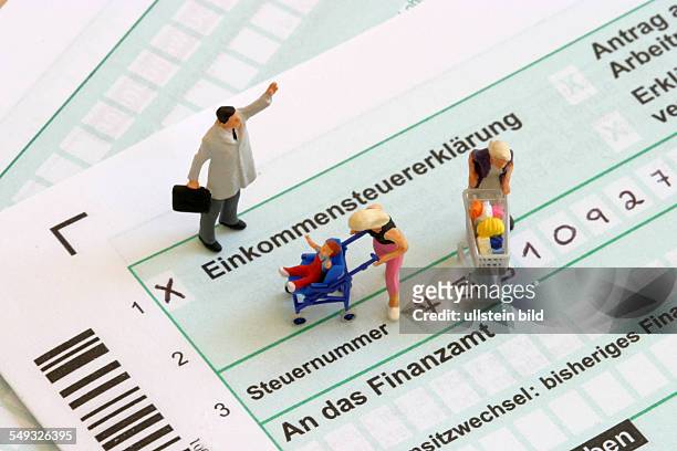 Tax identification form with figures of a businessman and two housewifes.