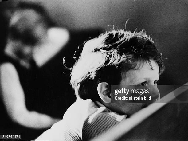 Germany, children watching a play in the childrens theater in Berlin, spectators, little boy