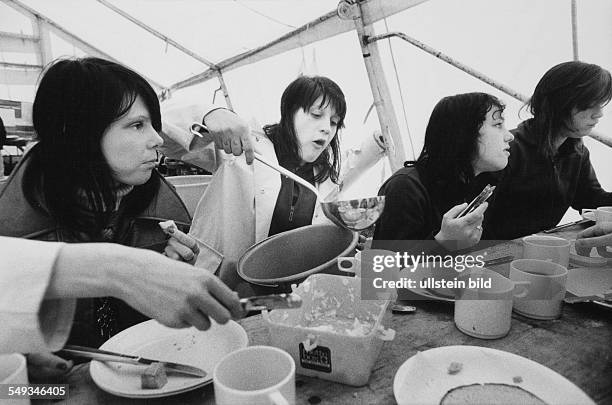 Girls eating in a tent in a camp, teenager