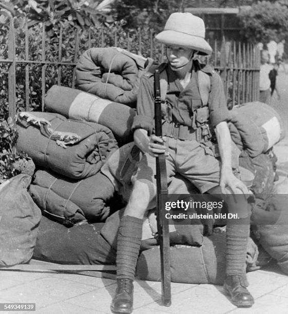 Burma Consequences of the colonial domination by the British Empire: a young British soldier on the street - 1939 - Photographer: Wolfgang Weber -...