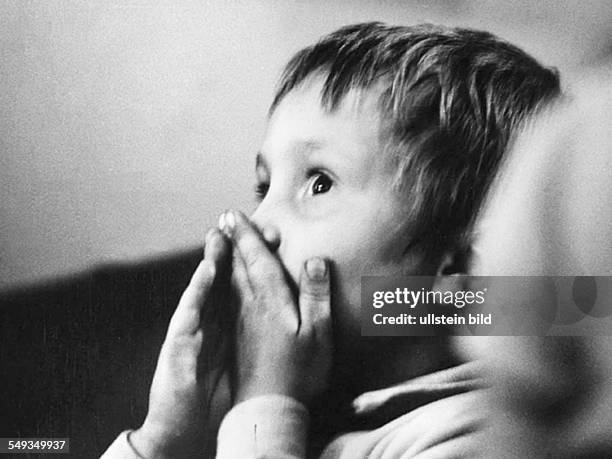 Germany, boy, spectator in childrens theater in the Reichskabarett in Berlin, in 1972 becomming the Grips-Theater, watching a play.