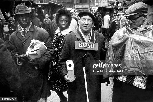 Great Britain, England, London, blind beggar on the street in Petticoat Lane.