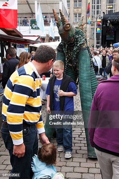 Kiel, Kieler Woche 2011, summer fair, Rathausplatz, fabulous creature and little boy