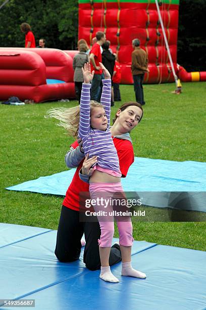 Kieler Woche 2011, Kiel, Hiroshima Park, childrens festival, playground, children, girl exercising gymnastics
