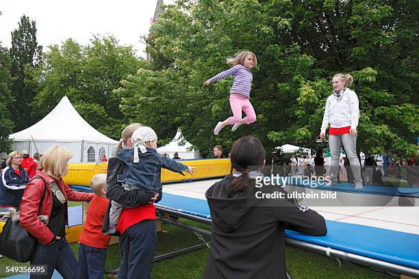Kieler Woche 2011, Kiel, Hiroshima Park, childrens festival, playground, children, girl jumping on a trampoline