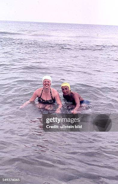 East Germany: Summer at the Baltic Sea, two women in the water, probably on Ruegen Island