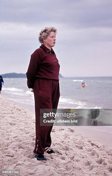East Germany: Summer at the Baltic Sea, a young woman on the beach, probably on Ruegen Island