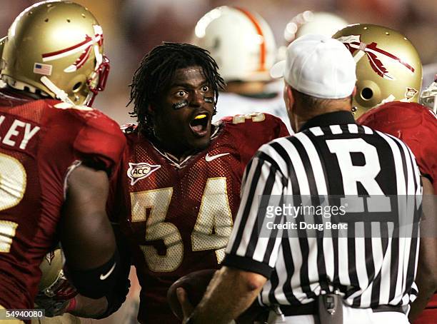 Linebacker Ernie Sims of the Florida State Seminoles argues with the referee after being called for a penalty for taking off his helmet in a game...