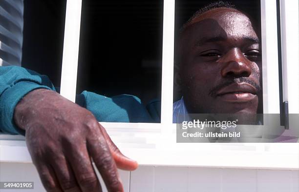 Spain, Tarfia: An immigrant is arrested by the Guardia Civil and is in a collective accommodation in Tarifa at the harbour