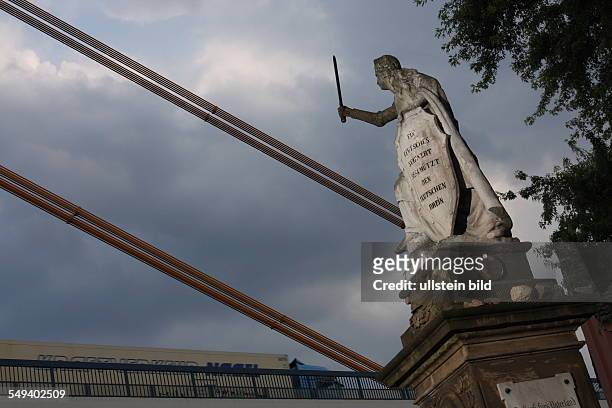 Germany, Reportage "Living at the highway 40". Duisburg, bridge over the river Rhine, monument for killed soldiers