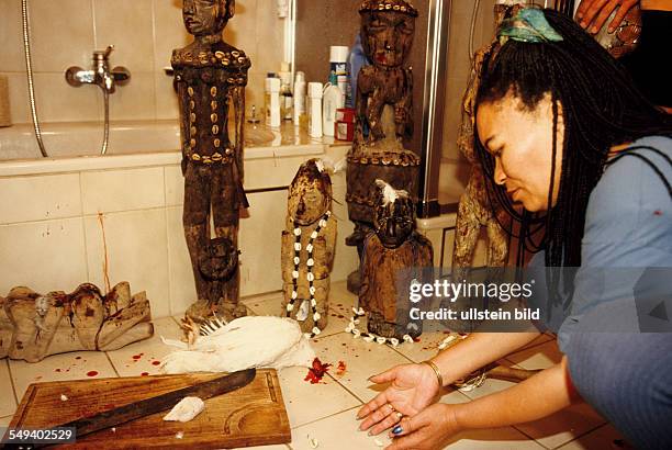 Germany, Wolfratshausen, Voodoo priest Caroline Huber, sacrificial ceremony