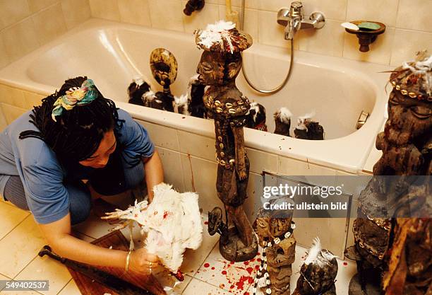 Germany, Wolfratshausen, Voodoo priest Caroline Huber, sacrificial ceremony