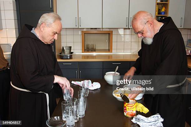 Germany, NRW, Werne: The oldest Capuchin monastery in the Rhenish-Westphalian Capuchin's province. Monks working in the kitchen after lunch.