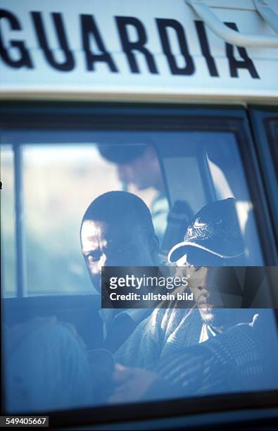 Spain, Arrest of immigrants at the beach of Tarifa by the Guardia Civil. Migrants in a police car.