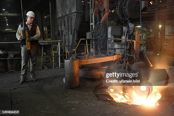 Germany, Muehlheim: The mechanical workshop of the Friedrich-Wilhelm steelworks. Worker at a melting furnace