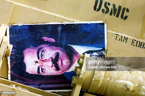 Iraq, Baghdad: Picture of Saddam Hussein with a headshot