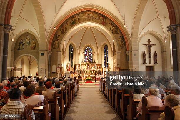 Germany, NRW, Dortmund: Service at St. Urbanus church before starting the Pentecost procession