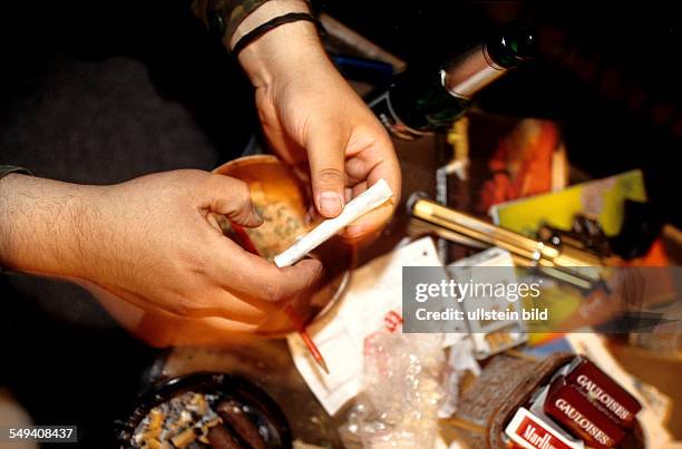 Germany, Berlin: Hip Hop in Berlin.- Kreuzberg; a turkish young person making a joint.