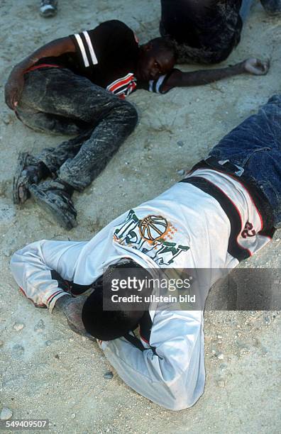Spain, Tarifa: Arrest and transportation of immigrants by the Guardia Civil at the beach of Tarifa. Migrants sleeping on the floor.