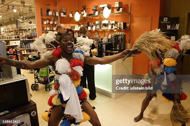 Germany, Muelheim: The Mibola group coming from Togo and from Benin and dancing in the Karstadt Arcades wearing Zangbeto dresses.