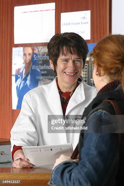 Germany, Essen, medicine physicist and non-medical practitioner Holger May, manager of the Laser Forum Essen. A patient at the registration....