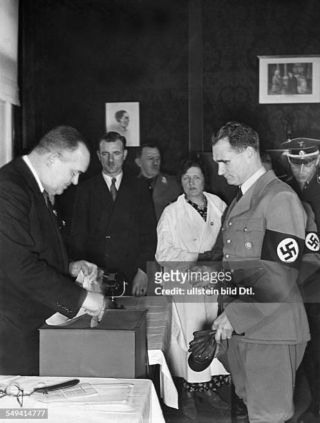 Parliamentary elections and referendum authorizing the Occupation of the Rhineland; Adolf Hitler's deputy Rudolf Hess in the polling station in the...