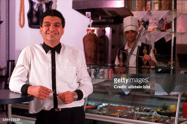 Germany, Essen, 1999: Turkish businessmen in Germany.- The manager of the DOENER PALACE in the Cinemaxx-Circus, Nihat Boscelik , 2 employees).