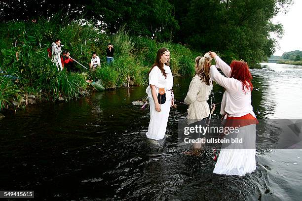 Germany, Schwerte: A Celtic-Germanic female priest and the witch Minerva holding an initiation of a woman. This woman converts to the Celtic-Germanic...