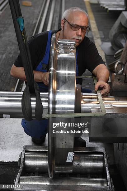 Germany, Bochsm: wheelset producer "Bochumer Verein für Verkehrstechnik". Work at a wheelset press